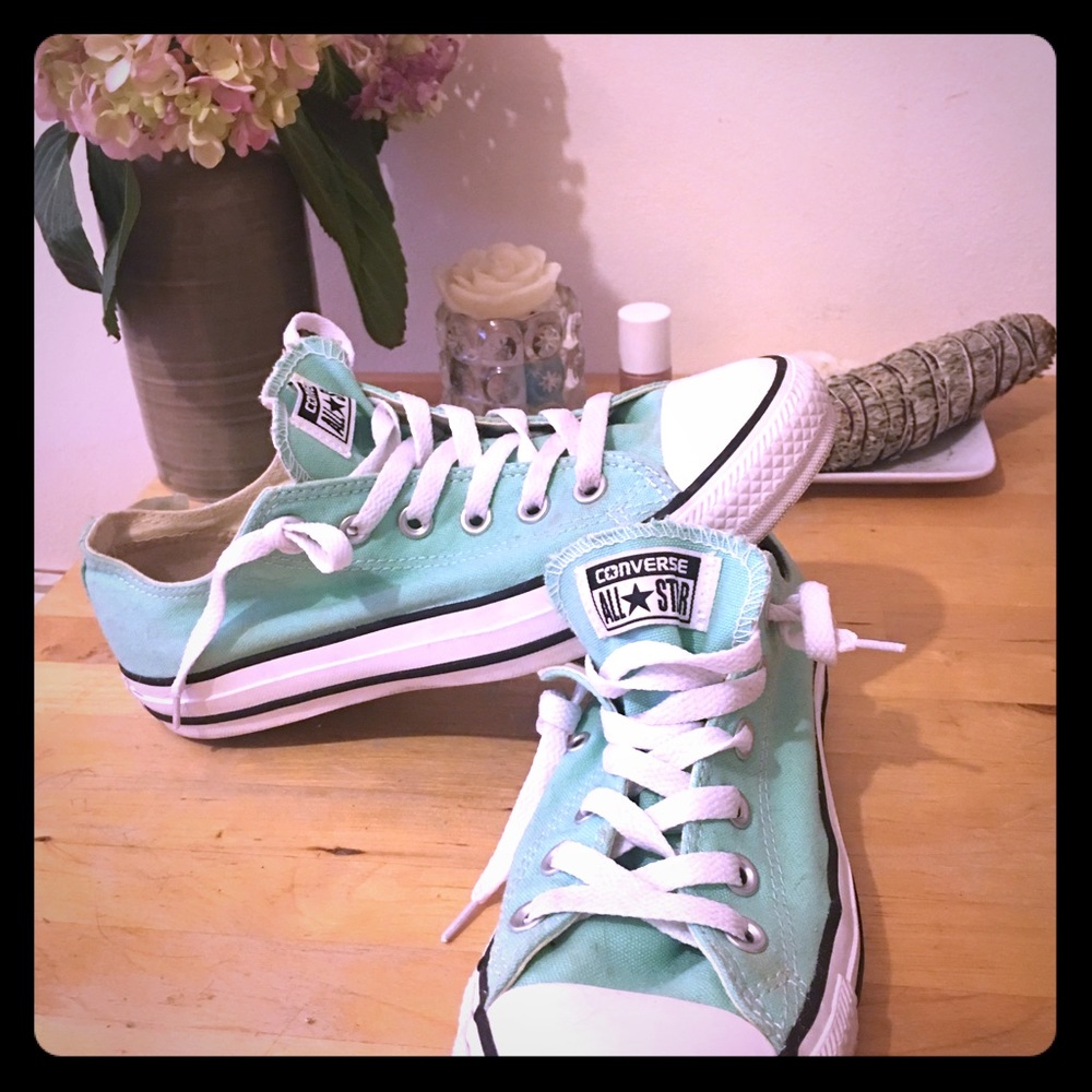 Converse low top teal Chuck Taylor.